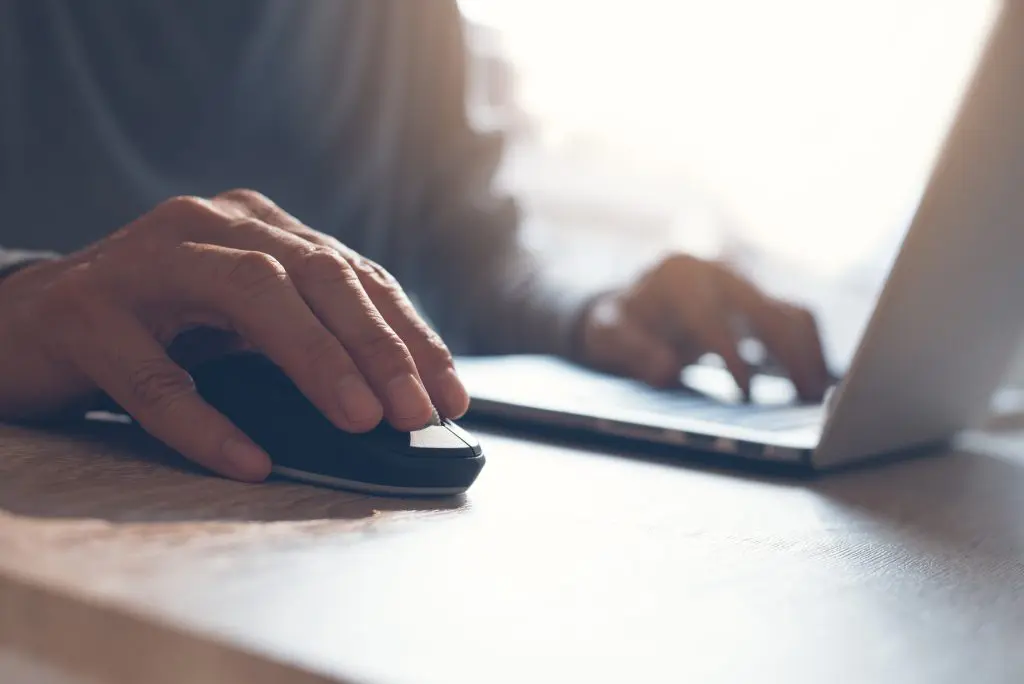man clicking computer mouse