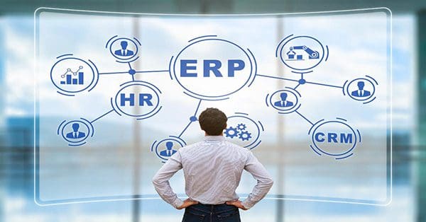 IT manager analyzing the architecture of ERP (Enterprise Resource Planning) system on virtual AR screen with connections between business intelligence (BI), production, HR and CRM modules