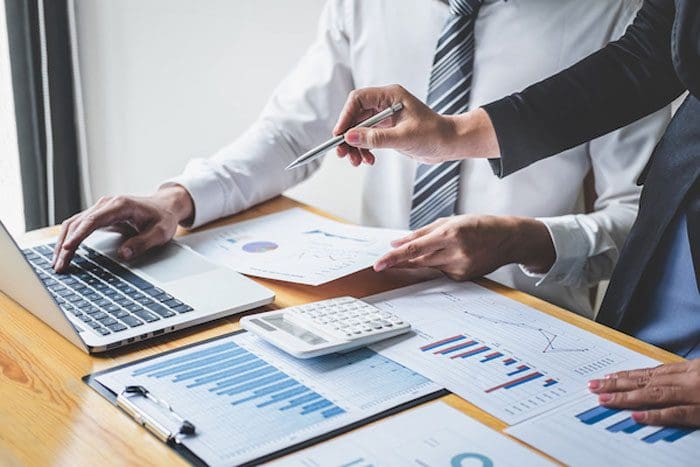 Professional Business partner discussing ideas planning and presentation project at meeting working and analysis at workspace, financial and investment concept, collaborative teamwork analyze data.