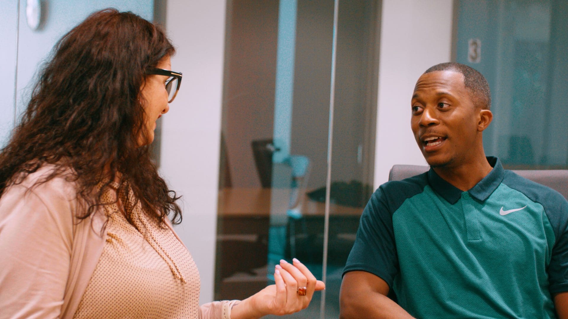 Two Bridgepoint employees talking in the Bridgepoint office